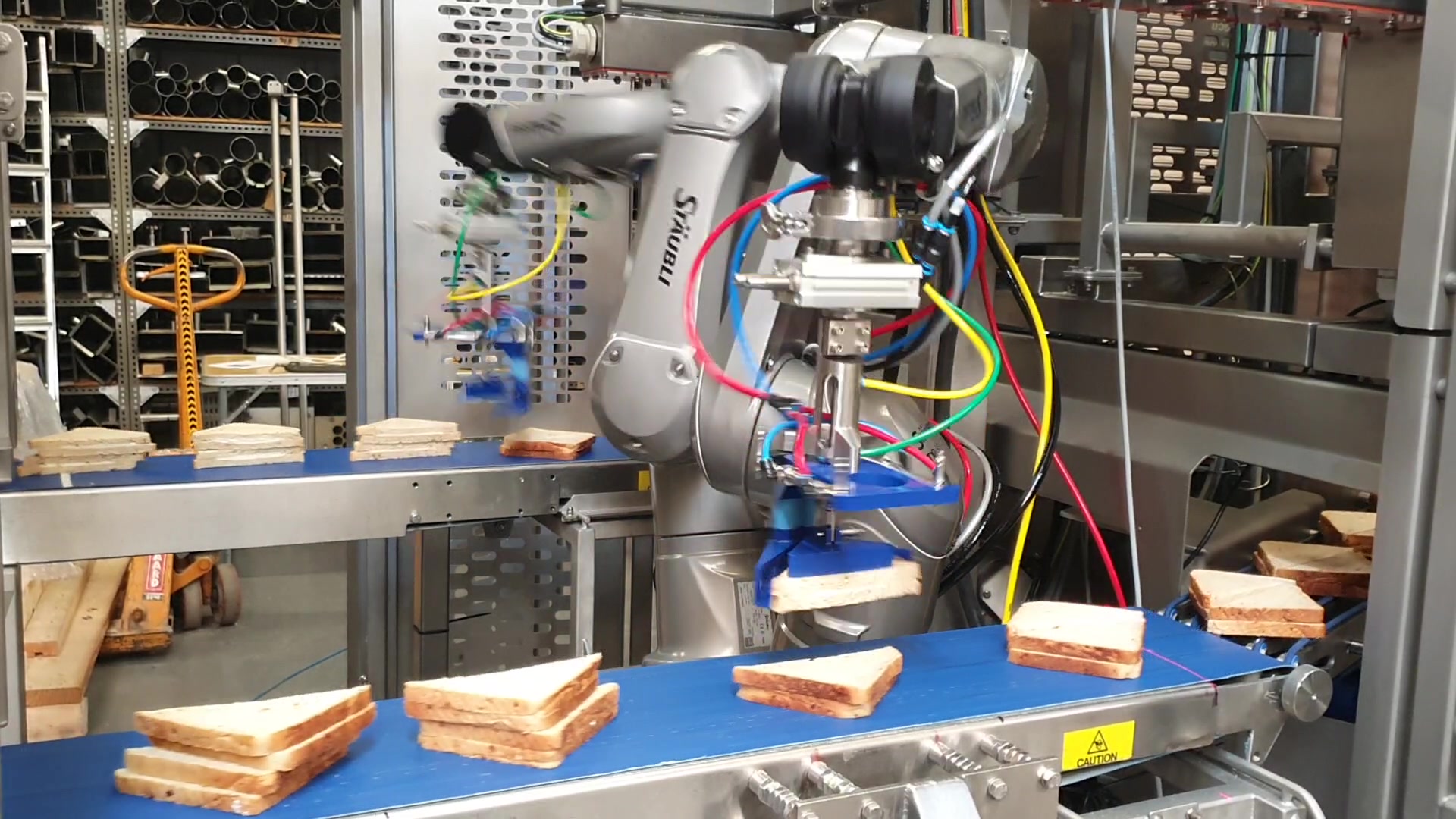 A Grote sandwich assembly robot stacks sandwich halves on top of each other.